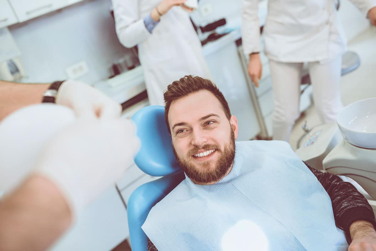 Man in dentist chair smiling image